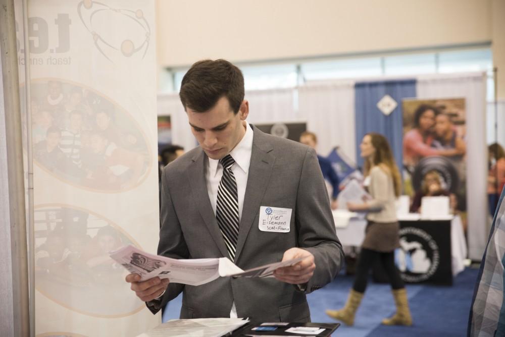 GVL / Luke Holmes - Tyler Eisemann looks over his resume. The Career Fair was held in the DeVos Place on Thursday, Feb. 23, 2016.