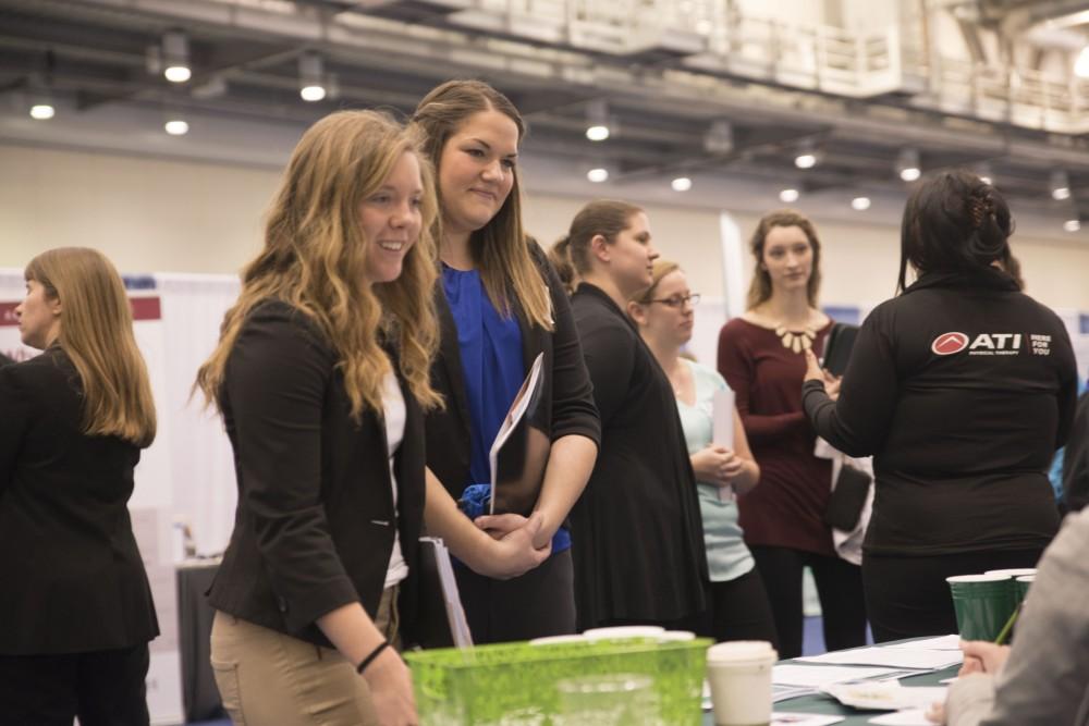 GVL / Luke Holmes - Students talk to a potential employer. The Career Fair was held in the DeVos Place on Thursday, Feb. 23, 2016.