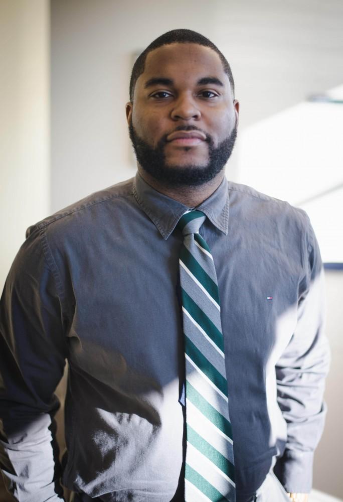 GVL / Luke Holmes - Professor Donald Mitchell poses in the DeVos building at the downtown Pew Campus.