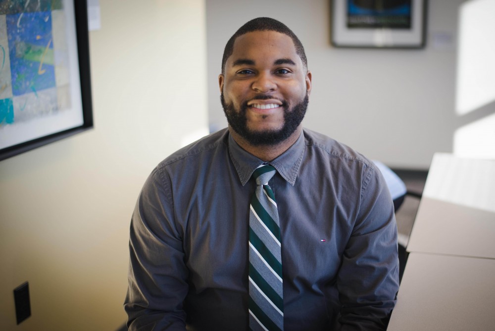 GVL / Luke Holmes - Professor Donald Mitchell poses in the DeVos building at the downtown Pew Campus.