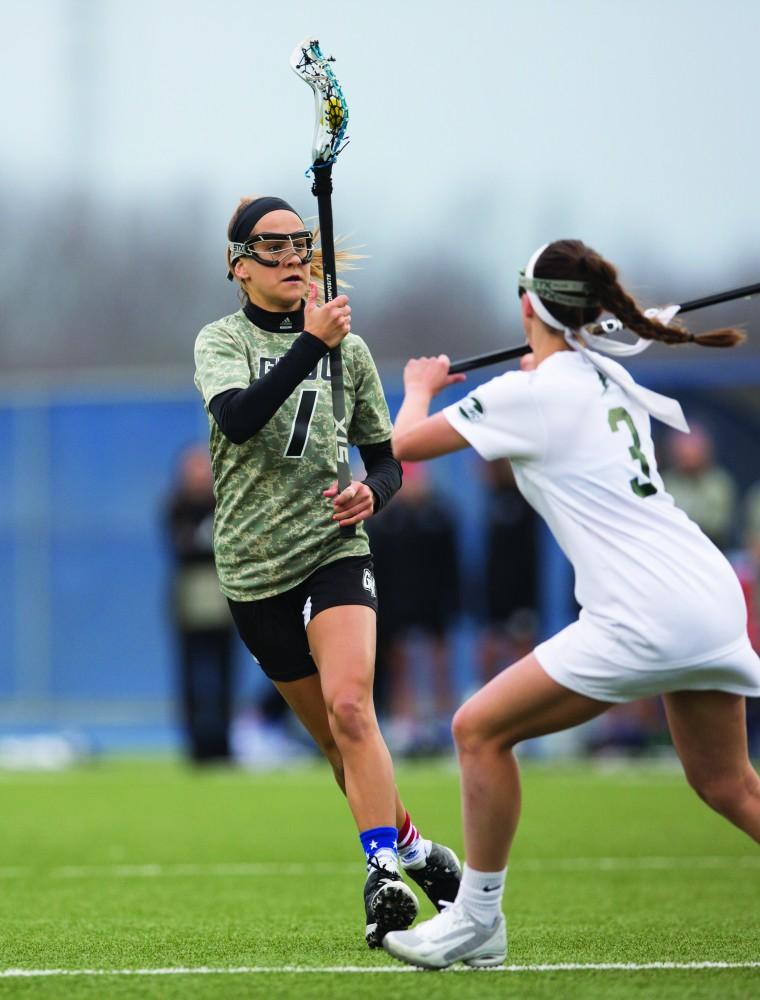 GVL / Kevin Sielaff - Ryan Skomial (1) works her way through Lake Erie's defense. Grand Valley defeats Lake Erie College with a final score of 19-2 on Friday, April 29, 2016 in Allendale. 