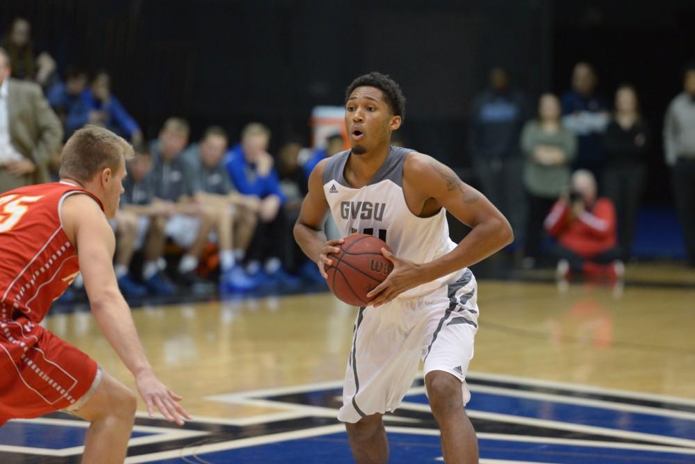 GVL / Luke Holmes - Chris Dorsey (14) calls a play up top. GVSU Men’s Basketball defeated Michigan Tech in the Fieldhouse Arena on Thursday, Feb. 16, 2017.