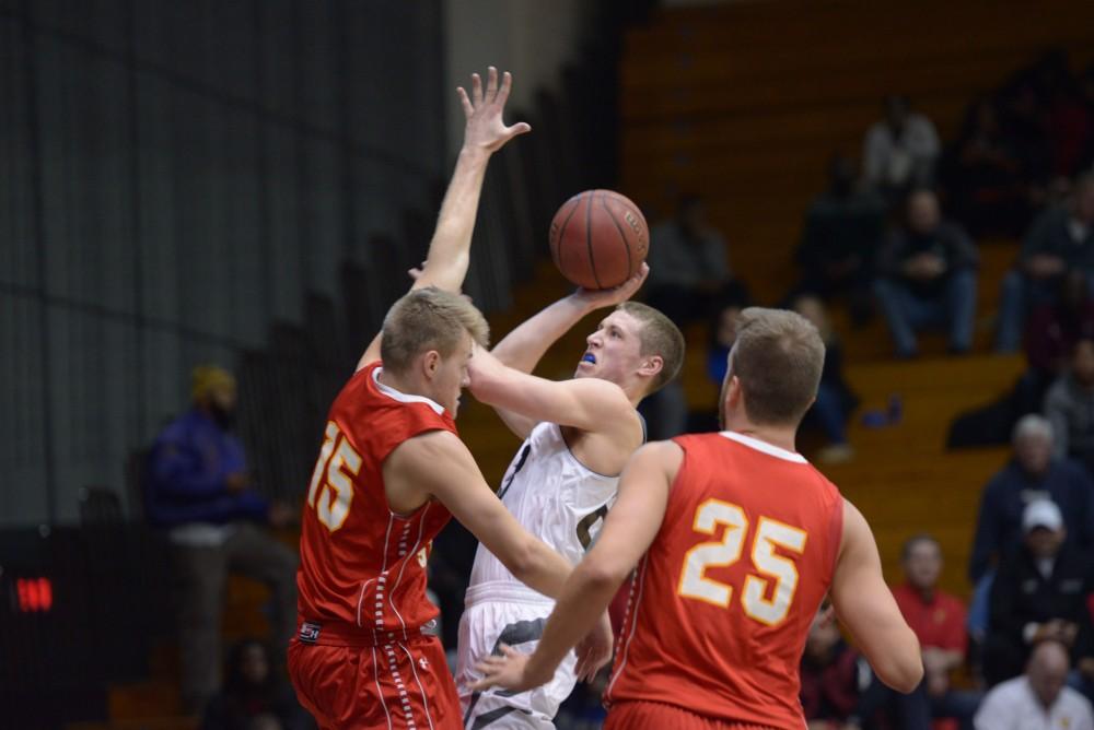 GVL / Luke Holmes - Myles Miller (12) pops a shot from the side of the court. GVSU Men’s Basketball defeated Michigan Tech in the Fieldhouse Arena on Thursday, Feb. 16, 2017.