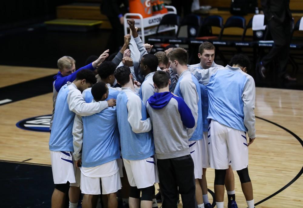 The team huddles before the game vs. Northwood inside the Fieldhouse Arena in Allendale on Thursday, Feb. 9, 2017. 