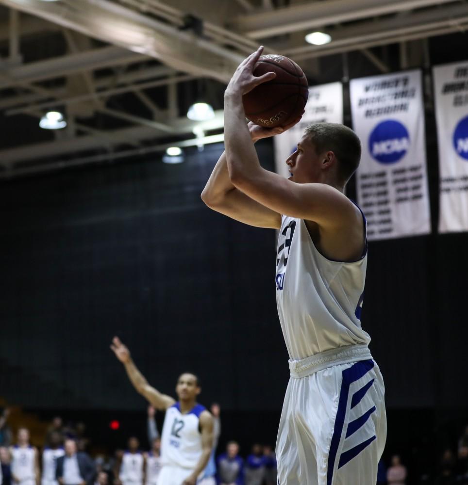 Luke Ryskamp (23) steps up for a three pointer during the game vs. Northwood inside the Fieldhouse Arena in Allendale on Thursday, Feb. 9, 2017. 