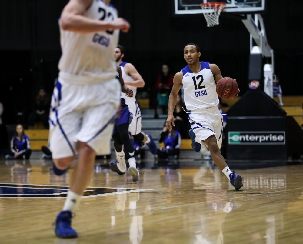 Mylers Miller (12) drives up the court during the game vs. Northwood inside the Fieldhouse Arena in Allendale on Thursday, Feb. 9, 2017. 