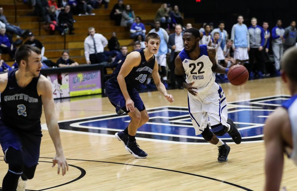 Juwan Starks (22) controls the ball at the top of the arc and drives in toward the paint during the game vs. Northwood inside the Fieldhouse Arena in Allendale on Thursday, Feb. 9, 2017. 