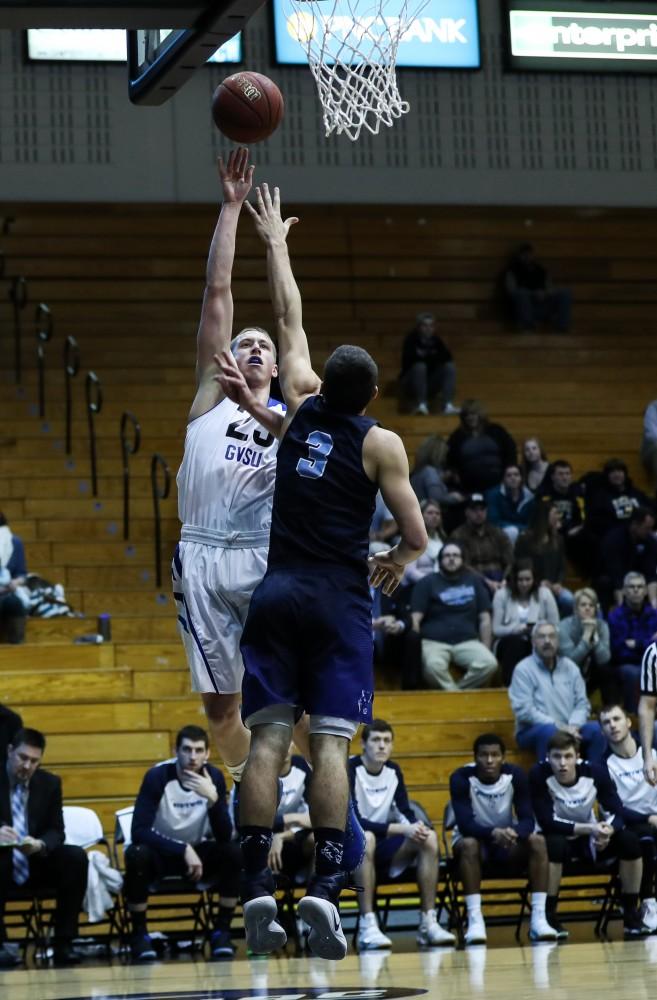 Luke Ryskamp (23) goes in for a lay-up during the game vs. Northwood inside the Fieldhouse Arena in Allendale on Thursday, Feb. 9, 2017. 