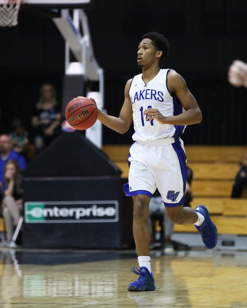 GVL/Kevin Sielaff - Chris Dorsey (14) moves the ball up the court during the game against Northern Michigan on Saturday, Feb. 18, 2017 inside the Fieldhouse Arena in Allendale.