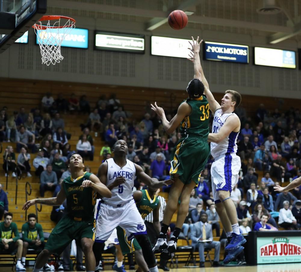 GVL/Kevin Sielaff - Drake Baar (21) tosses up a shot during the game against Northern Michigan on Saturday, Feb. 18, 2017 inside the Fieldhouse Arena in Allendale.