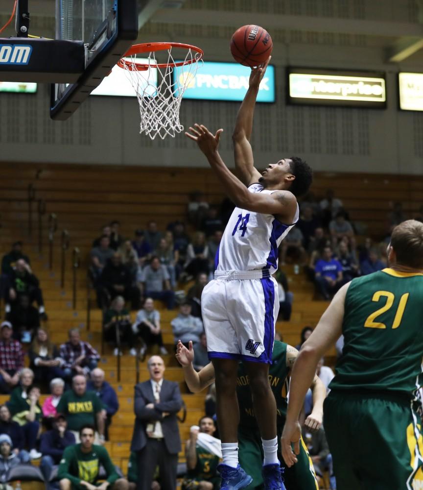 GVL/Kevin Sielaff - Chris Dorsey (14) goes up for a layup during the game against Northern Michigan on Saturday, Feb. 18, 2017 inside the Fieldhouse Arena in Allendale.