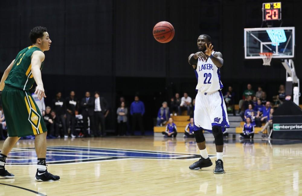 GVL/Kevin Sielaff - Juwan Starks (22) passes the ball off during the game against Northern Michigan on Saturday, Feb. 18, 2017 inside the Fieldhouse Arena in Allendale.