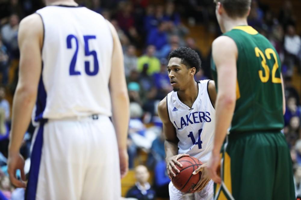 GVL/Kevin Sielaff - Chris Dorsey (14) pulls up for a free throw attempt during the game against Northern Michigan on Saturday, Feb. 18, 2017 inside the Fieldhouse Arena in Allendale.