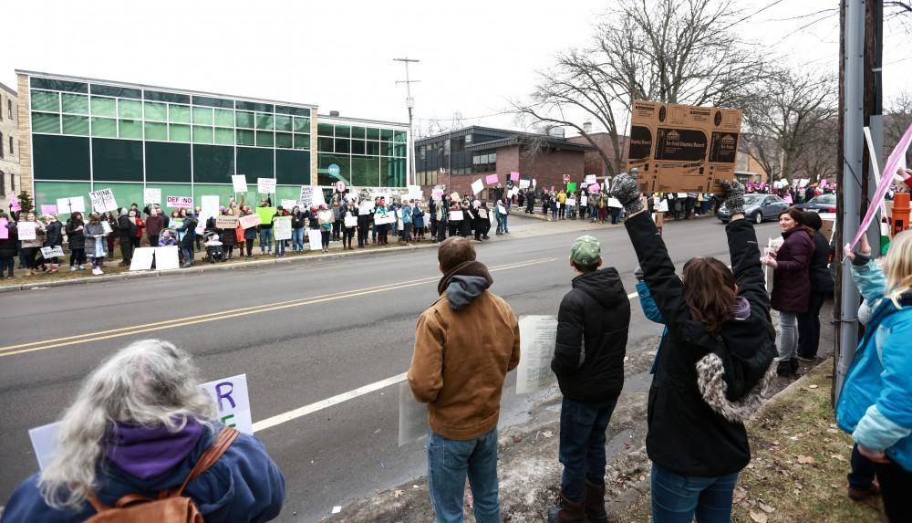 Protesters and supporters gather in front of Planned Parenthood on  425 Cherry St SE in Grand Rapids on Saturday, Feb. 11, 2017. 