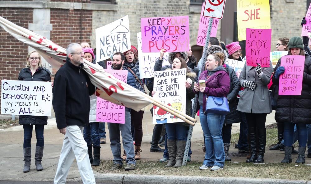 Supporters of Planned Parenthood voice their opposition to the presence of members of Front Line Apologetics Ministries in front of the Planned Parenthood building on  425 Cherry St SE in Grand Rapids on Saturday, Feb. 11, 2017. 