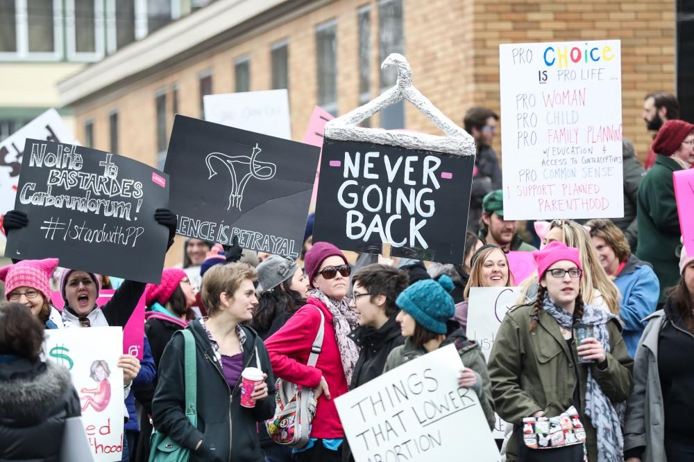 Protesters and supporters gather in front of Planned Parenthood on  425 Cherry St SE in Grand Rapids on Saturday, Feb. 11, 2017. 