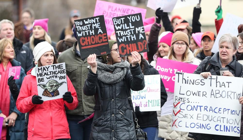 Protesters and supporters gather in front of Planned Parenthood on  425 Cherry St SE in Grand Rapids on Saturday, Feb. 11, 2017. 