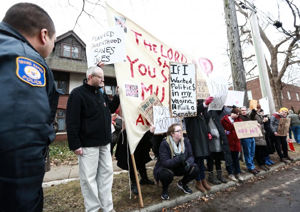 Supporters of Planned Parenthood voice their opposition to the presence of members of Front Line Apologetics Ministries in front of the Planned Parenthood building on  425 Cherry St SE in Grand Rapids on Saturday, Feb. 11, 2017. 