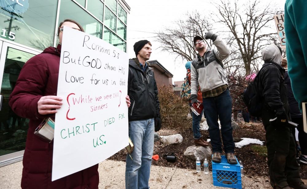 Members of Front Line Apologetics Ministries preach in front of the Planned Parenthood building on 425 Cherry St SE in Grand Rapids on Saturday, Feb. 11, 2017. 