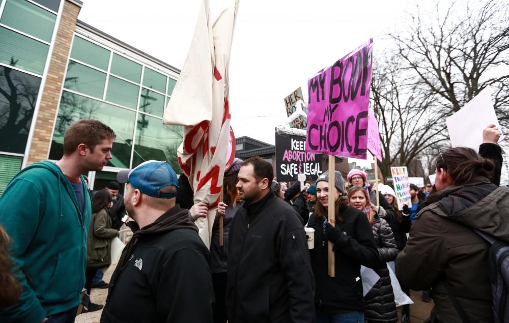 Protesters and supporters gather in front of Planned Parenthood on  425 Cherry St SE in Grand Rapids on Saturday, Feb. 11, 2017. 