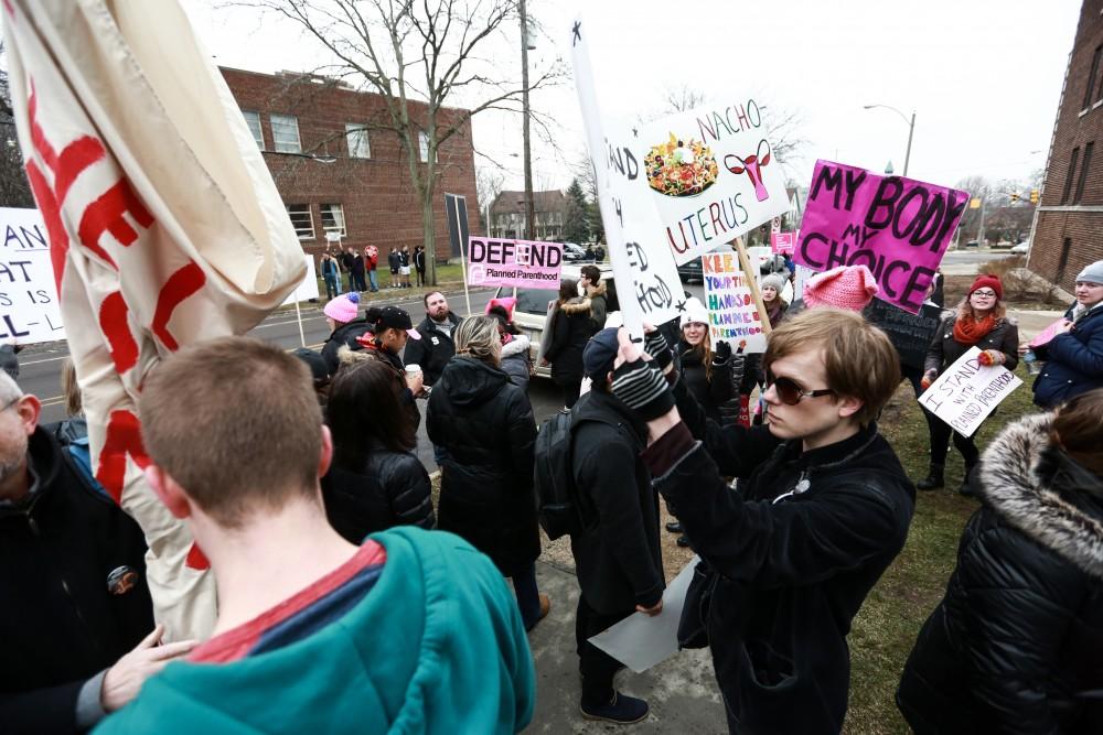 Protesters and supporters gather in front of Planned Parenthood on  425 Cherry St SE in Grand Rapids on Saturday, Feb. 11, 2017. 