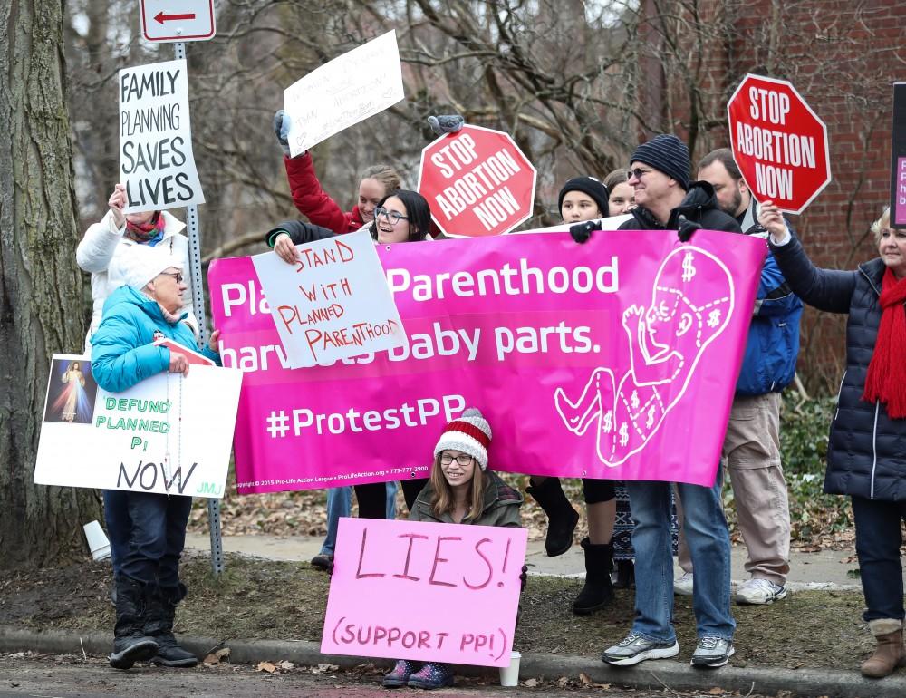 Protesters and supporters gather in front of Planned Parenthood on  425 Cherry St SE in Grand Rapids on Saturday, Feb. 11, 2017. 