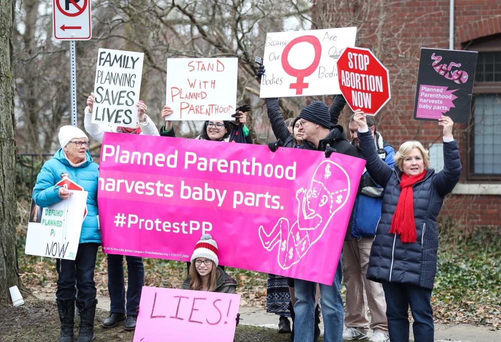 Protesters and supporters gather in front of Planned Parenthood on  425 Cherry St SE in Grand Rapids on Saturday, Feb. 11, 2017. 