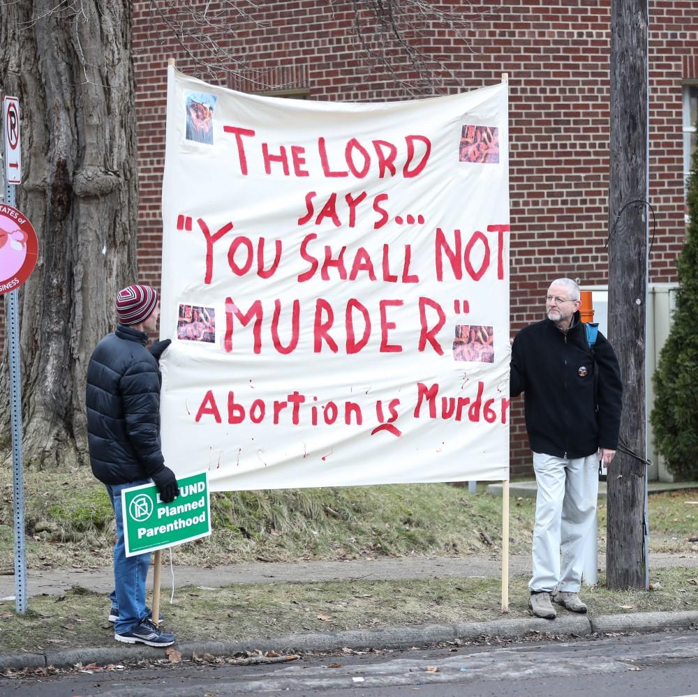 Protesters and supporters gather in front of Planned Parenthood on  425 Cherry St SE in Grand Rapids on Saturday, Feb. 11, 2017. 