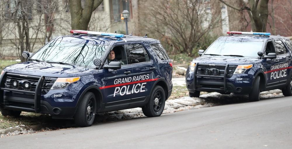 Grand Rapids patrol units stand by in front of the Planned Parenthood building on 425 Cherry St SE in Grand Rapids on Saturday, Feb. 11, 2017. 