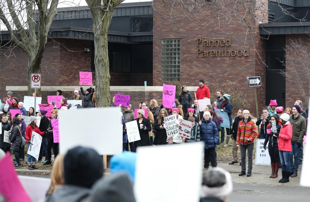 Protesters and supporters gather in front of Planned Parenthood on  425 Cherry St SE in Grand Rapids on Saturday, Feb. 11, 2017. 