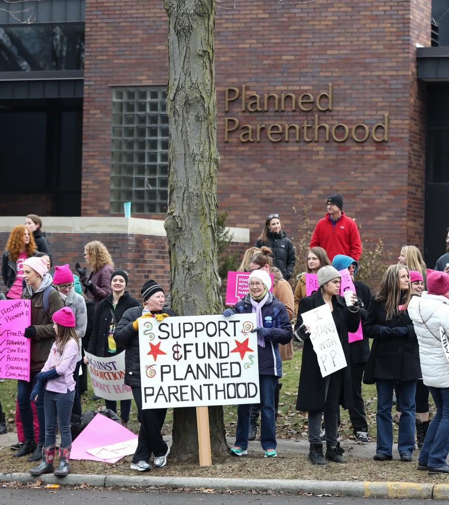 Protesters and supporters gather in front of Planned Parenthood on  425 Cherry St SE in Grand Rapids on Saturday, Feb. 11, 2017. 