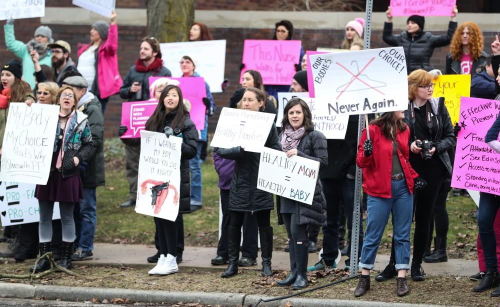 Protesters and supporters gather in front of Planned Parenthood on  425 Cherry St SE in Grand Rapids on Saturday, Feb. 11, 2017. 