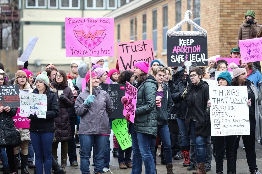 Protesters and supporters gather in front of Planned Parenthood on  425 Cherry St SE in Grand Rapids on Saturday, Feb. 11, 2017. 