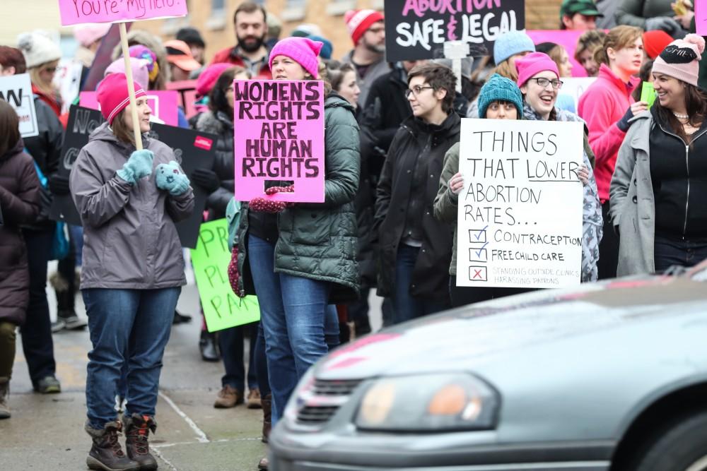 Protesters and supporters gather in front of Planned Parenthood on  425 Cherry St SE in Grand Rapids on Saturday, Feb. 11, 2017. 