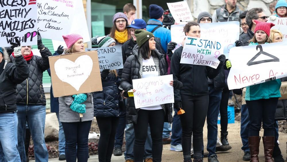 Protesters and supporters gather in front of Planned Parenthood on  425 Cherry St SE in Grand Rapids on Saturday, Feb. 11, 2017. 