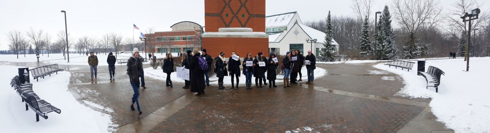 GVL / Courtesy - Jason BlanksStudents gather around the clock tower on Tuesday, Jan. 31, 2017 in protest of President Trumps immigration ban.