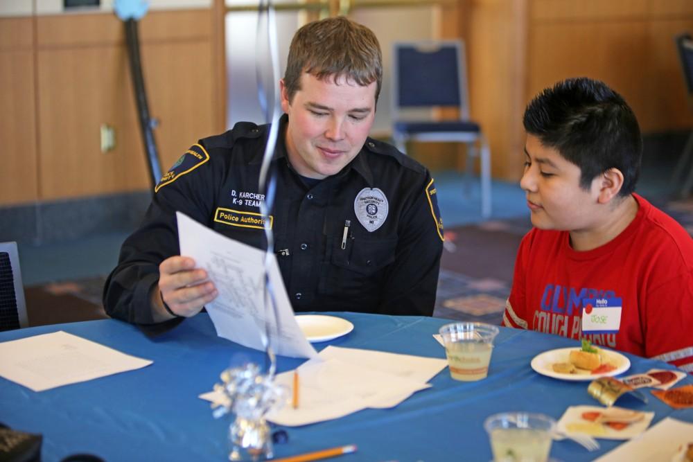 GVL / Emily Frye      
Local kids get the chance to talk with Officer Karcher on Saturday Feb. 18, 2017.