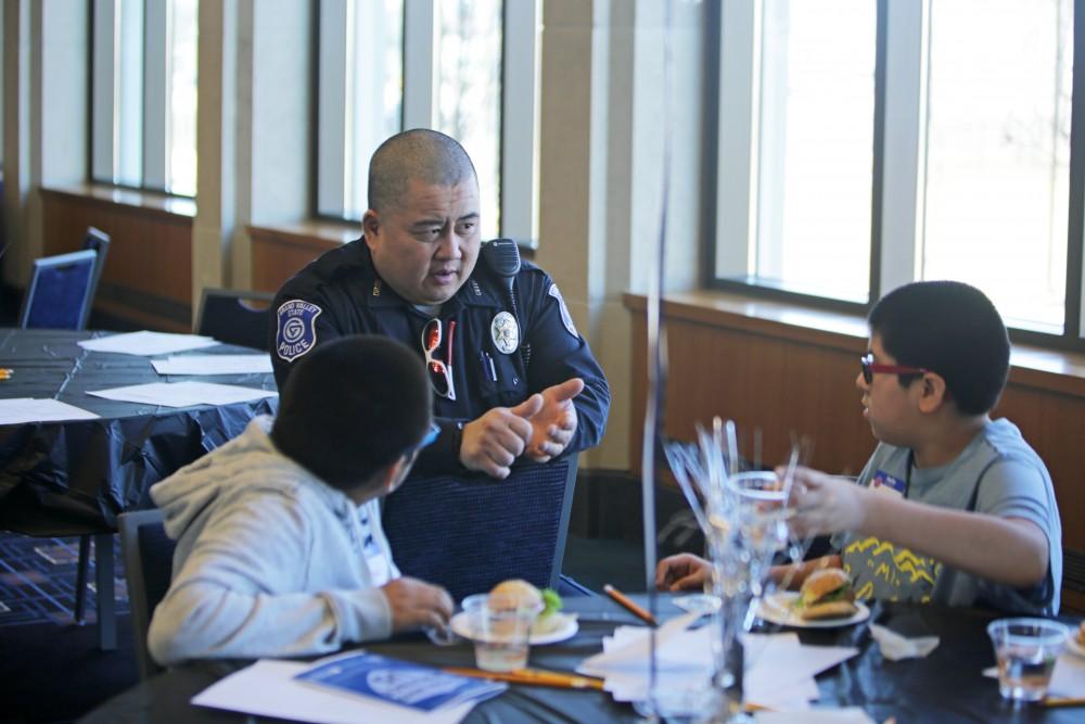 GVL / Emily Frye      
Local kids get the chance to talk with Officer Minh Lien on Saturday Feb. 18, 2017.