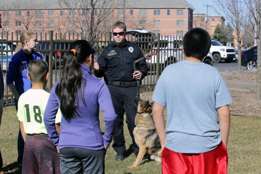 GVL / Emily Frye      
Local kids get the chance to hang out with Officer Karcher's K-9 on Saturday Feb. 18, 2017.