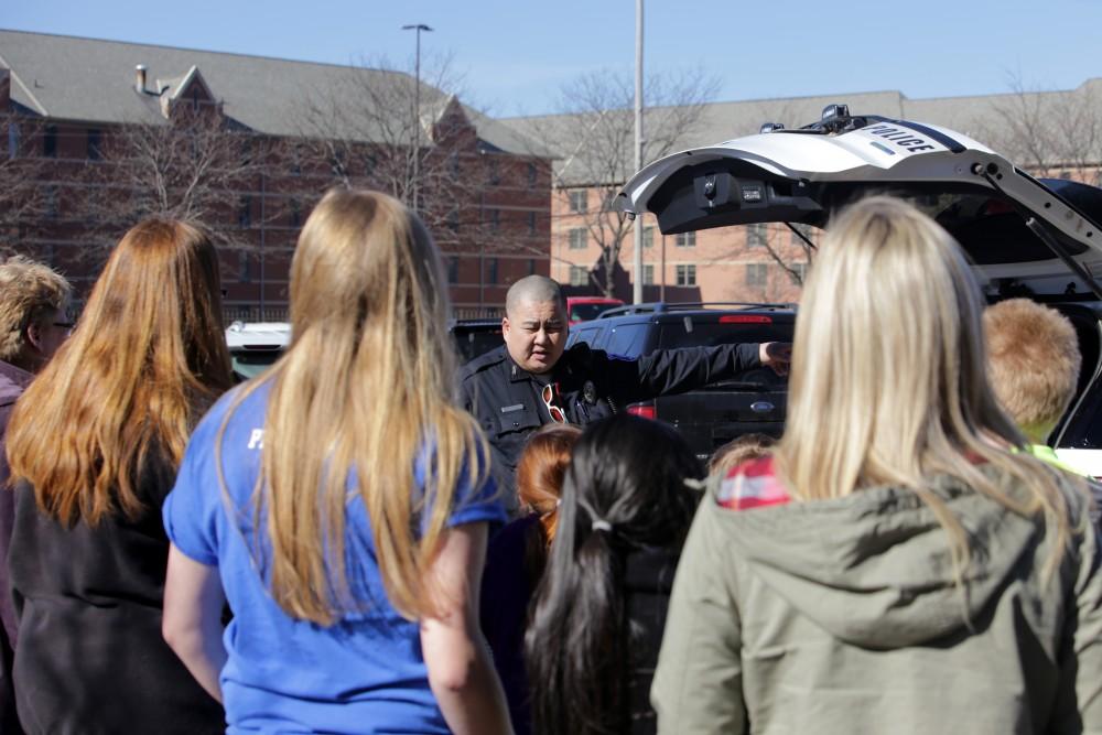 GVL / Emily Frye      
Local kids get the chance to talk with Officer Minh Lien on Saturday Feb. 18, 2017.