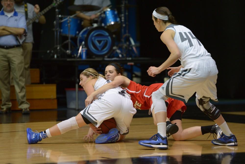 GVL / Luke Holmes - Taylor Lutz (10) protects the ball from the defender. GVSU Women’s Basketball defeated Ferris State University on Monday, Jan. 30, 2016.