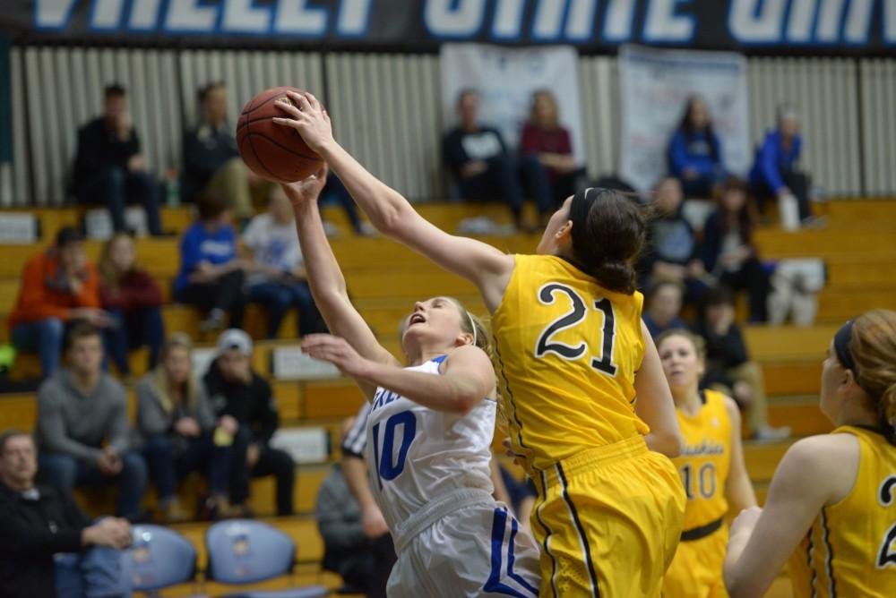 GVL / Luke Holmes - Taylor Lutz (10) gets packed by the defender. GVSU Women’s Basketball defeated Michigan Tech in the Fieldhouse Arena on Thursday, Feb. 16, 2017.