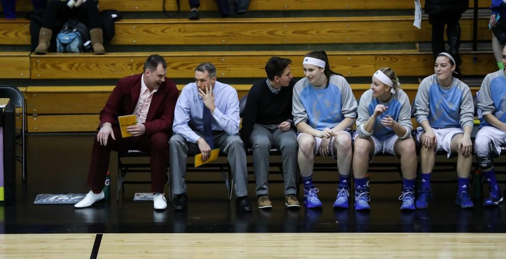 Head coach Mike Williams and Assistant Head Coach Phil Sayers discuss on the bench as the game vs. Northwood gets underway inside the Fieldhouse Arena in Allendale on Thursday, Feb. 9, 2017. 