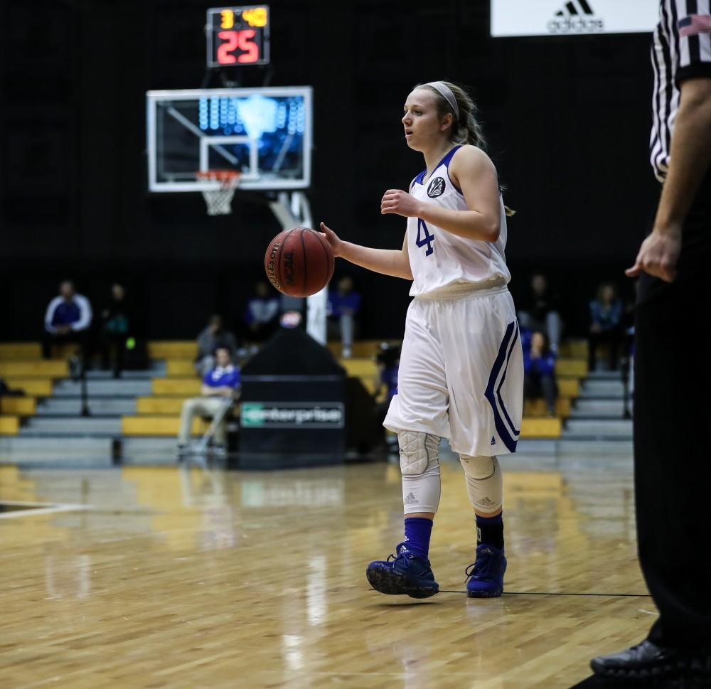 Jenn DeBoer (4) controls the ball and looks to pass during the game vs. Northwood inside the Fieldhouse Arena in Allendale on Thursday, Feb. 9, 2017. 