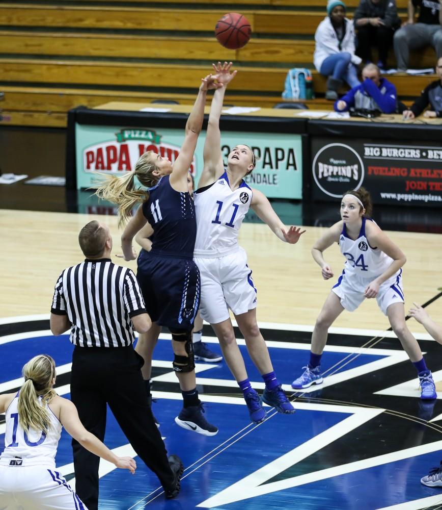 Piper Tucker (11) takes the opening tip of the game during the game vs. Northwood inside the Fieldhouse Arena in Allendale on Thursday, Feb. 9, 2017. 