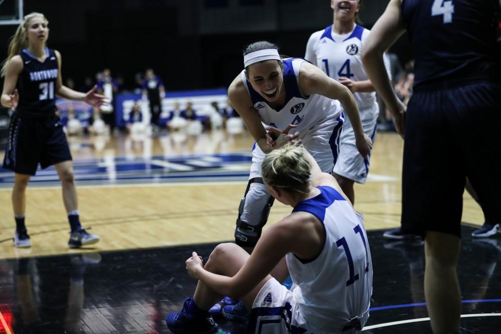 Korynn Hincka (44) celebrates with Piper Tucker (11) as she is fouled on a shot attempt during the game vs. Northwood inside the Fieldhouse Arena in Allendale on Thursday, Feb. 9, 2017. 