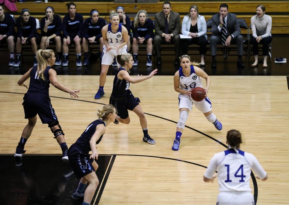 Taylor Lutz (10) passes the ball off during the game vs. Northwood inside the Fieldhouse Arena in Allendale on Thursday, Feb. 9, 2017. 