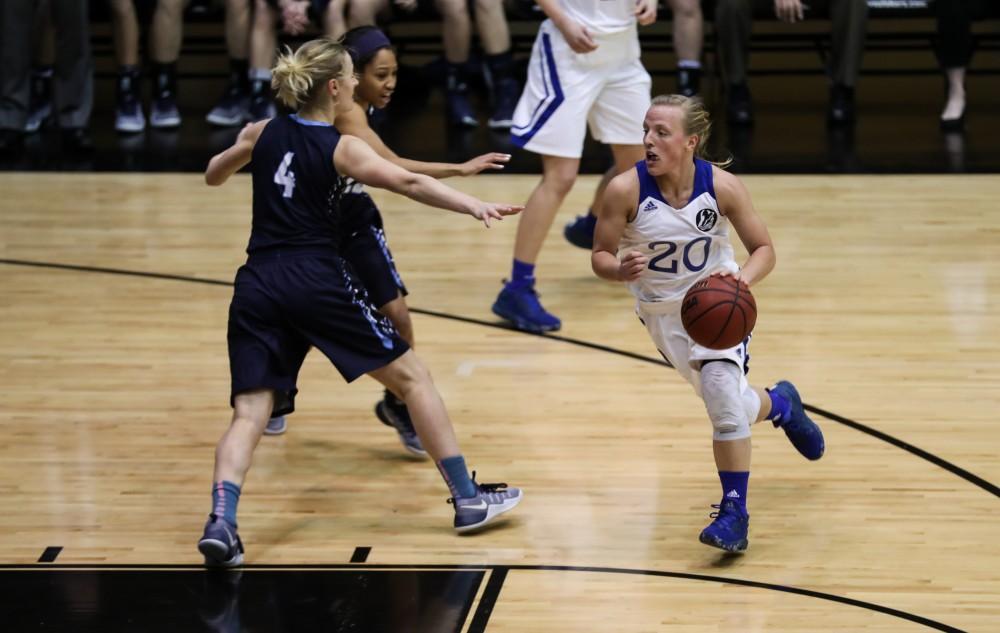 Janae Langs (20) drives in toward the hoop during the game vs. Northwood inside the Fieldhouse Arena in Allendale on Thursday, Feb. 9, 2017. 