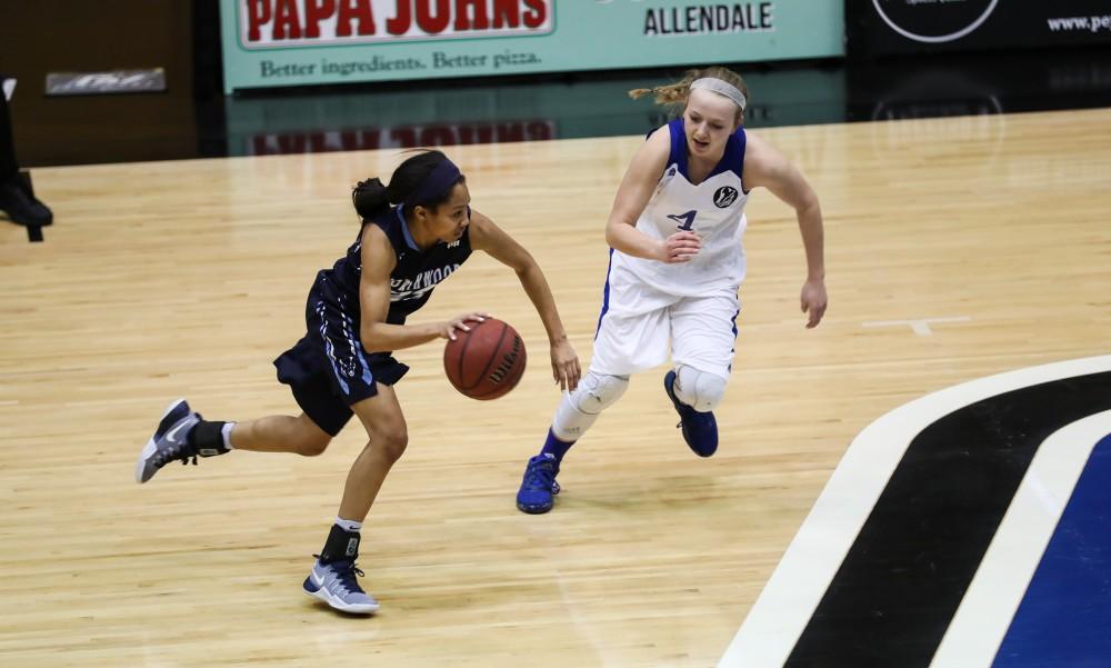 Jenn DeBoer (4) pursues a Northwood point guard during the game vs. Northwood inside the Fieldhouse Arena in Allendale on Thursday, Feb. 9, 2017. 