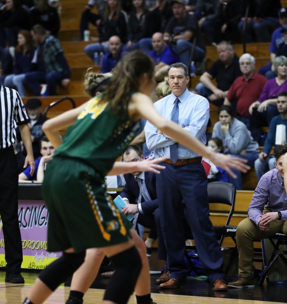 GVL/Kevin Sielaff - Head coach Mike Williams looks on toward the play from the bench during the game against Northern Michigan on Saturday, Feb. 18, 2017 inside the Fieldhouse Arena in Allendale.